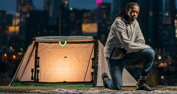 Young entrepreneur crowdfunding to launch home in a bag concept Young entrepreneur crowdfunding to launch home in a bag concept