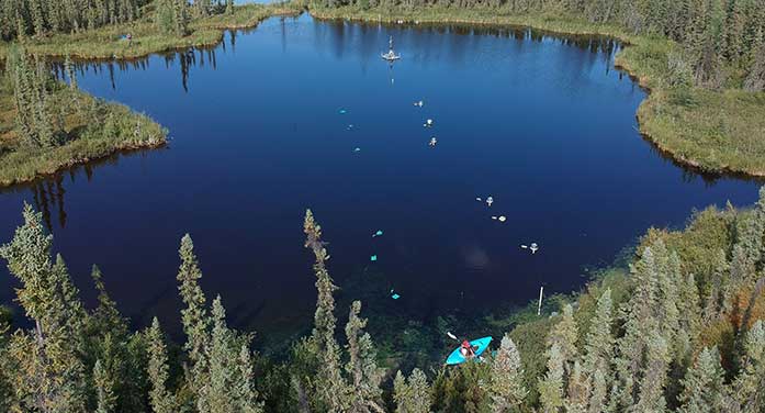 U of A student Trisha Eliot water samples lake boreal forest