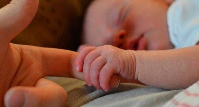 Newborn holding mother The sad reality of teen mothers who give birth in care