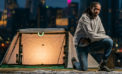 Young entrepreneur crowdfunding to launch home in a bag concept Young entrepreneur crowdfunding to launch home in a bag concept