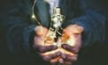 Man holding lightbulb Energy sector key to reviving post-pandemic Canadian economy