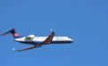 white and red air plane in flight Bombardier the poster child of pork-barrel cronyism