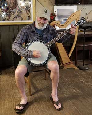 Playing the banjo in the Hotel Ymir