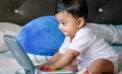 baby boy playing toy infant Study finds link between gut bacteria and enhanced cognition in infant boys