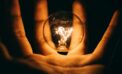 hand holding light lightbulb electricity energy Materials harvest electricity from wasted heat
