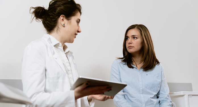 young adult woman doctor medical patient Learning sessions help teen heart patients prepare for the adult world