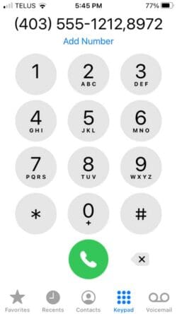 Dial an extension for a telephone number on iphone