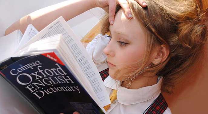 Girl-reading-dictionary-memorization